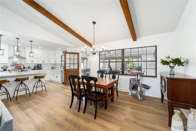 dining space featuring a chandelier, lofted ceiling with beams, and light hardwood / wood-style floors