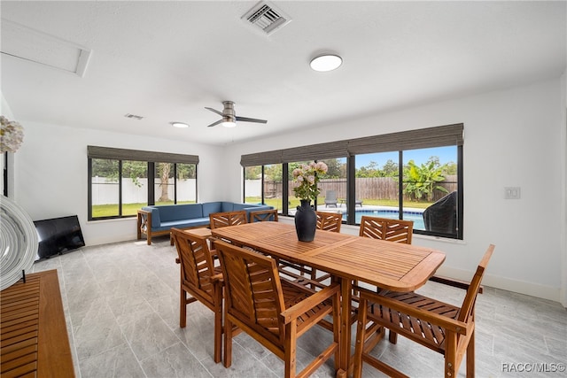 dining room featuring ceiling fan