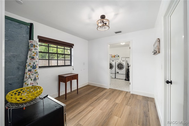 washroom featuring washer and dryer and hardwood / wood-style flooring