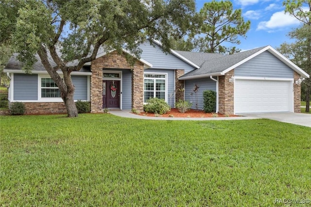 5317 W Tortuga Loop, Lecanto, FL 34461 - view of front of house with stone siding, an attached garage, a front yard, and driveway