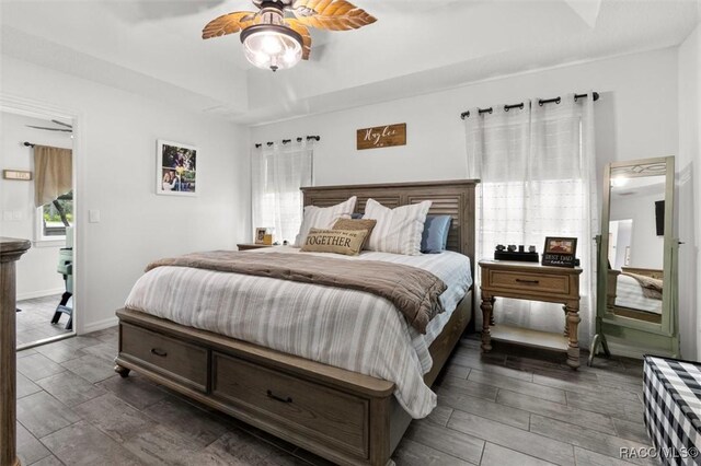 5317 W Tortuga Loop, Lecanto, FL 34461 - bedroom featuring a raised ceiling, ceiling fan, and wood finished floors