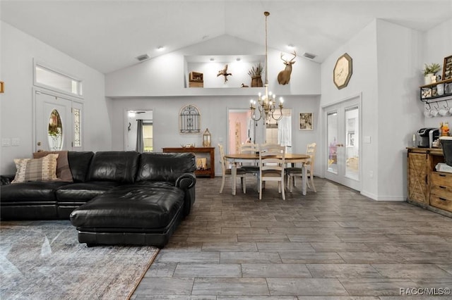 5317 W Tortuga Loop, Lecanto, FL 34461 - living room with a chandelier, high vaulted ceiling, wood finish floors, and plenty of natural light