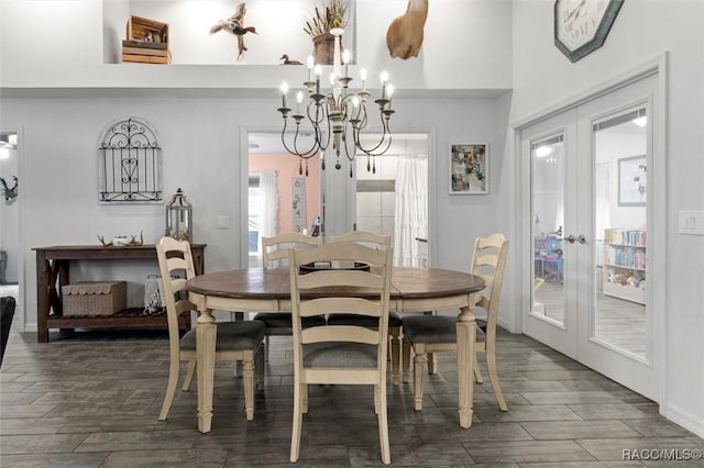 5317 W Tortuga Loop, Lecanto, FL 34461 - dining area with french doors, a chandelier, and wood finished floors
