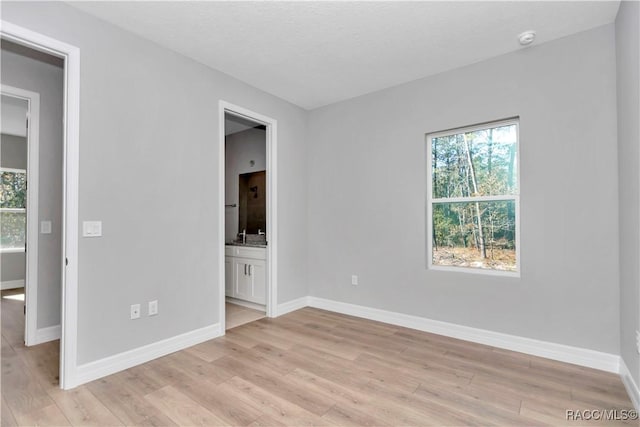 unfurnished room featuring light wood-type flooring