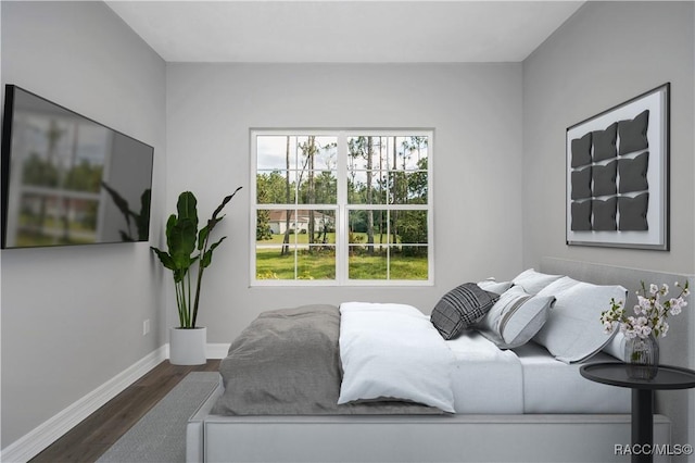 bedroom featuring dark hardwood / wood-style flooring