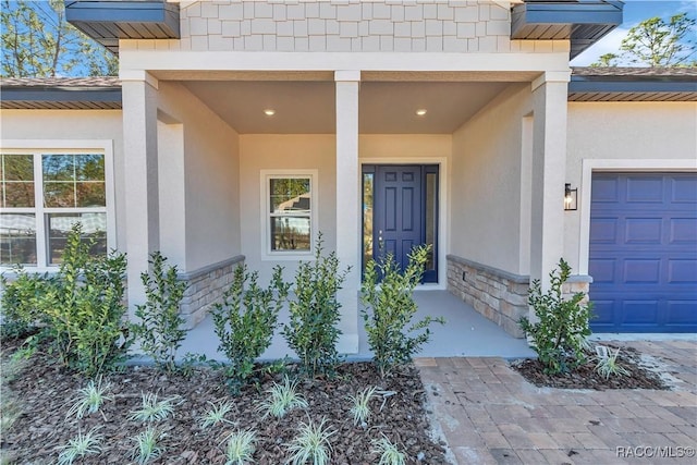 doorway to property featuring a garage