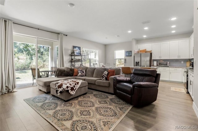 living room with light hardwood / wood-style floors