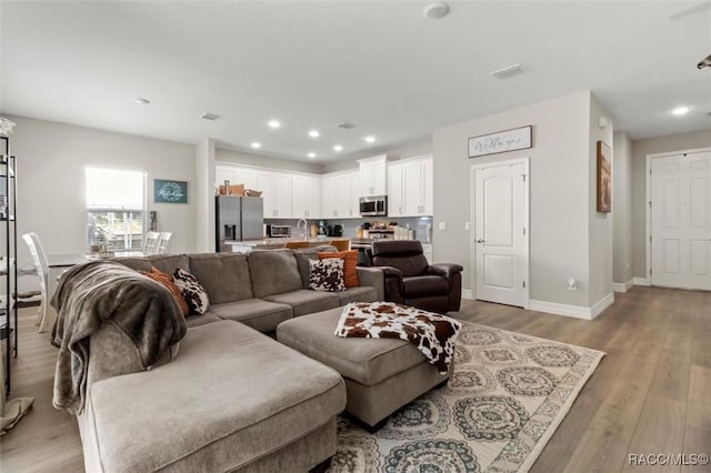 living room with light wood-type flooring