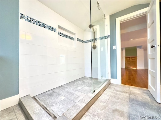 bathroom with tiled shower