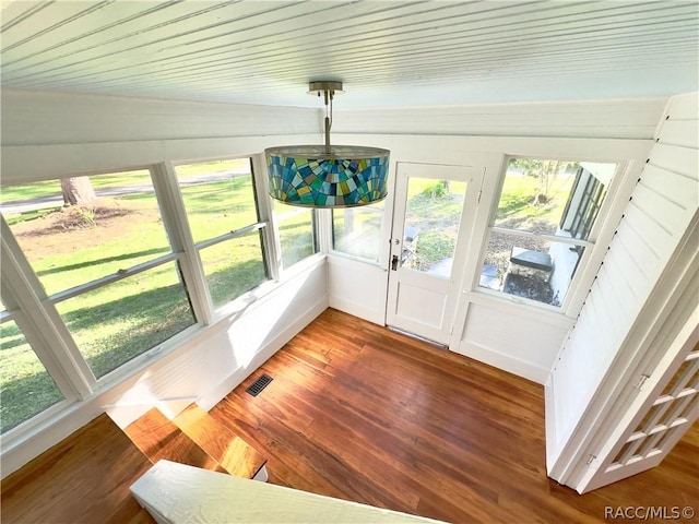 sunroom / solarium featuring wooden ceiling