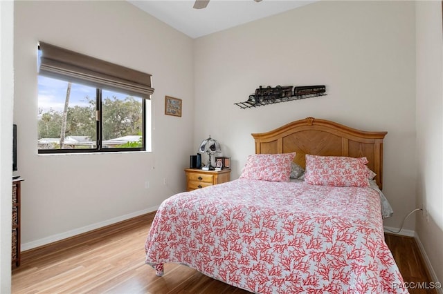 bedroom with ceiling fan and light hardwood / wood-style flooring