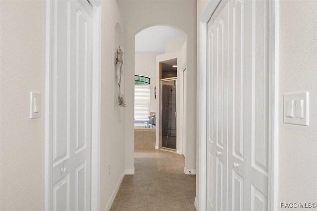 hallway with light tile patterned floors