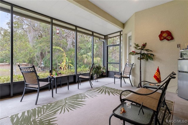 sunroom with beam ceiling