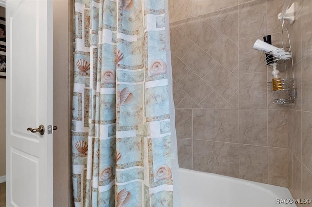 bathroom with shower / tub combo with curtain