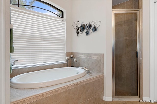 bathroom with shower with separate bathtub