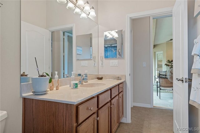 bathroom with tile patterned flooring and vanity