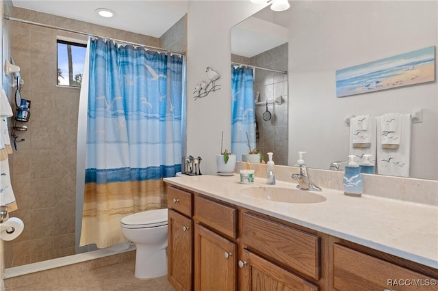 bathroom featuring toilet, vanity, tile patterned flooring, and curtained shower