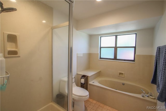 full bath featuring a bath, a stall shower, toilet, and tile patterned floors