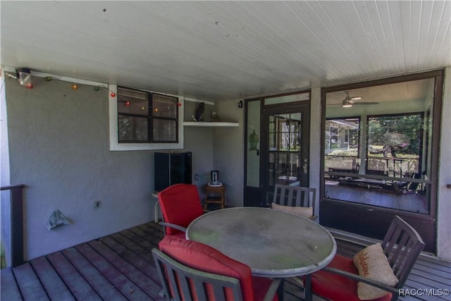 wooden deck with outdoor dining space