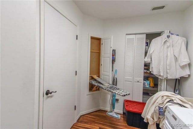 spacious closet featuring visible vents and wood finished floors