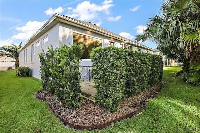 view of property exterior featuring a yard