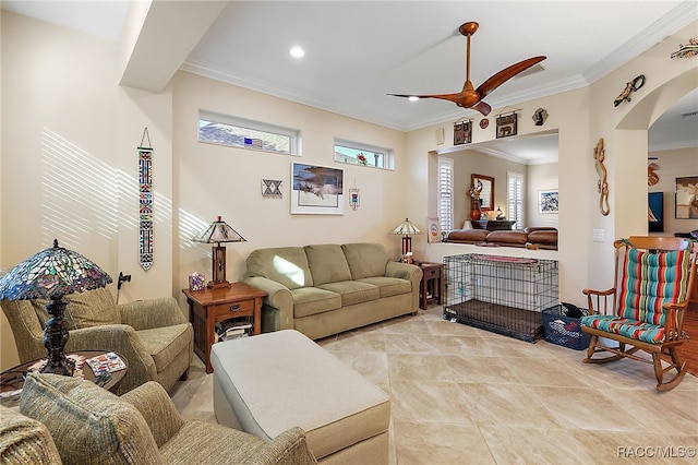 living room with ceiling fan and crown molding