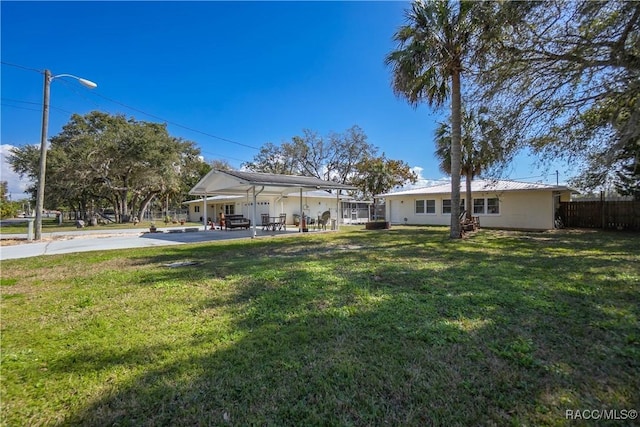 view of yard featuring a carport