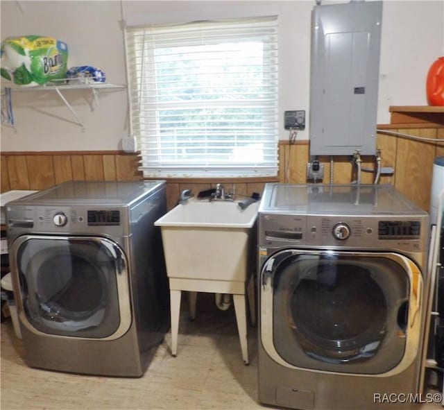 laundry area featuring washer and dryer and electric panel