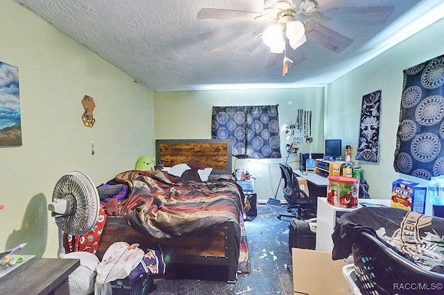 carpeted bedroom with ceiling fan and a textured ceiling