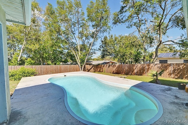 view of swimming pool with a patio