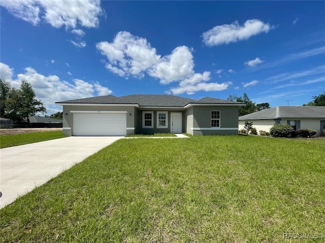 single story home featuring an attached garage, driveway, a front yard, and stucco siding