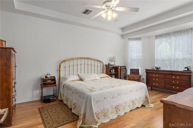 bedroom with ceiling fan and light hardwood / wood-style floors