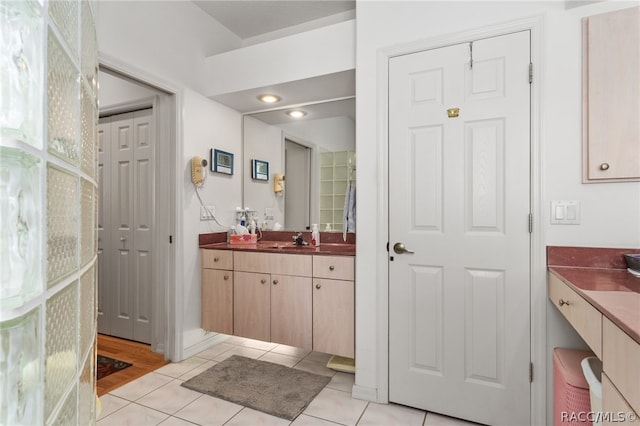 bathroom with tile patterned flooring and vanity