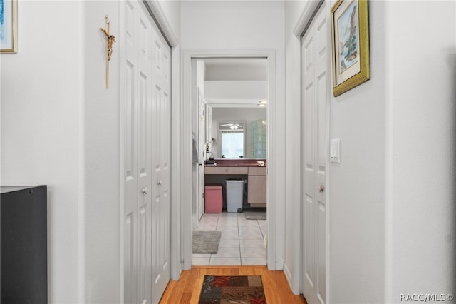 hallway featuring light wood-type flooring