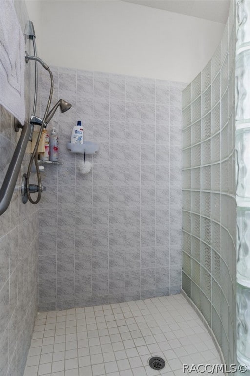 bathroom with a tile shower