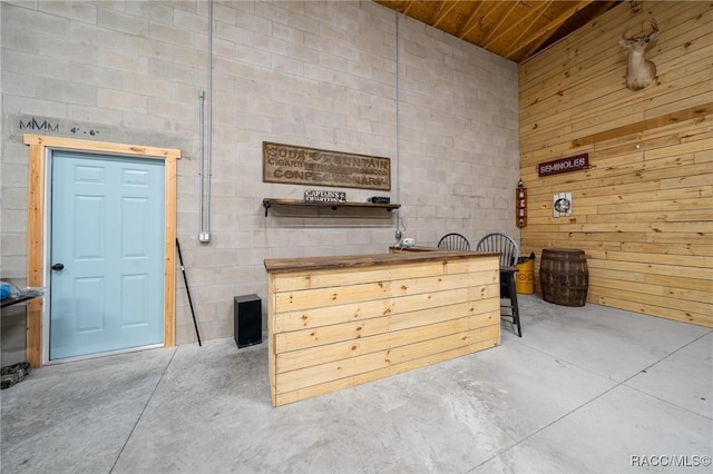 interior space featuring unfinished concrete flooring