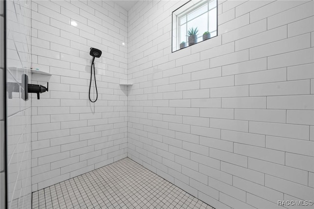 bathroom with tiled shower