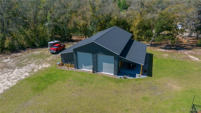 view of outdoor structure featuring driveway