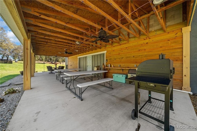 view of patio featuring ceiling fan and outdoor dining area