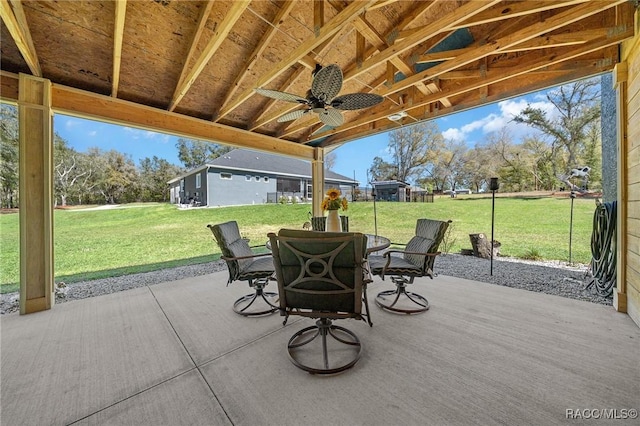 view of patio featuring outdoor dining area and ceiling fan