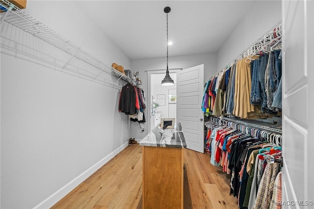 spacious closet featuring light wood-style floors