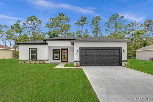 view of front of house featuring central AC unit, a garage, and a front lawn