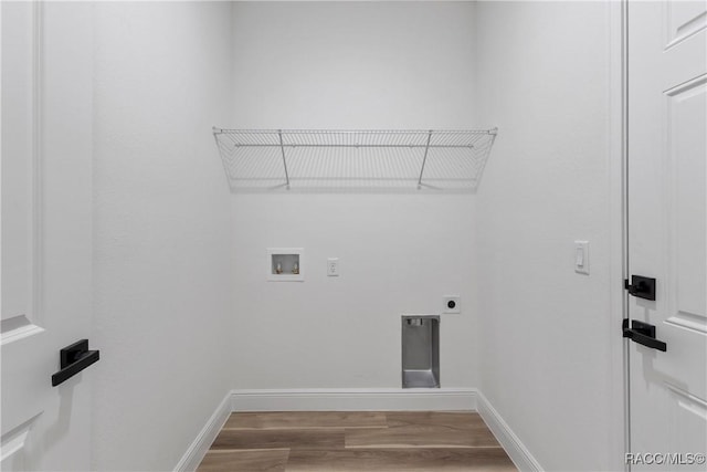 1413 W America Pl, Citrus Springs, FL 34434 - clothes washing area featuring hookup for an electric dryer, laundry area, hookup for a washing machine, baseboards, and wood finished floors