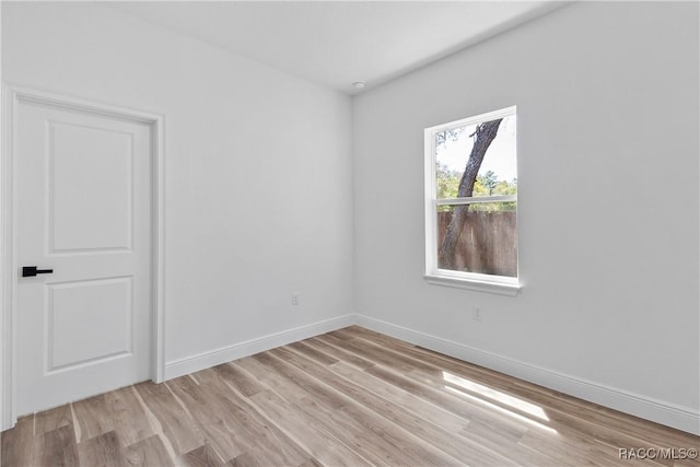 1413 W America Pl, Citrus Springs, FL 34434 - unfurnished room featuring light wood-style flooring and baseboards