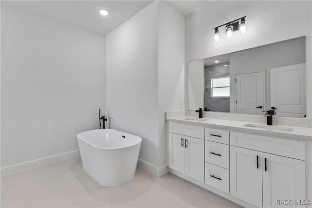 1413 W America Pl, Citrus Springs, FL 34434 - bathroom with double vanity, a sink, a freestanding bath, and baseboards