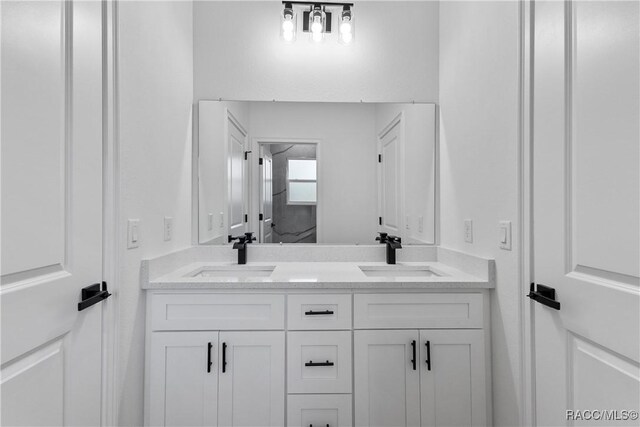 1413 W America Pl, Citrus Springs, FL 34434 - full bath with double vanity and a sink