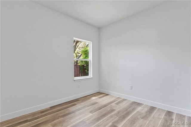1413 W America Pl, Citrus Springs, FL 34434 - unfurnished room with light wood-style flooring and baseboards