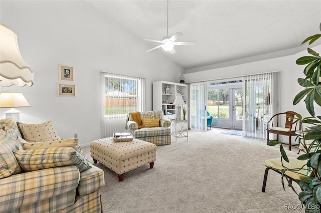 carpeted living room with ceiling fan, french doors, high vaulted ceiling, and a healthy amount of sunlight