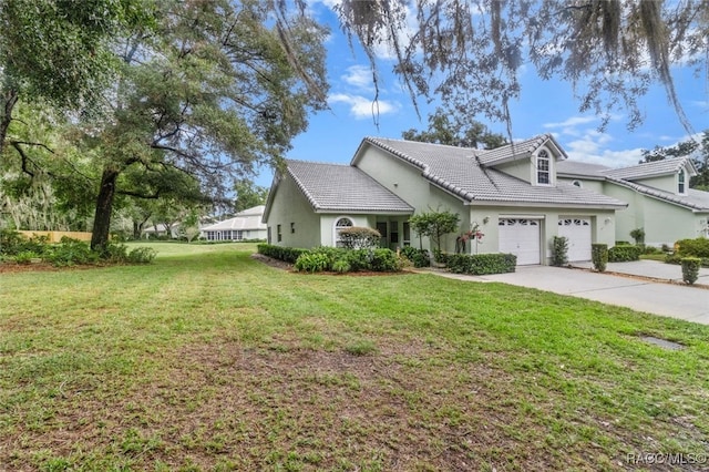 view of front facade featuring a garage and a front lawn