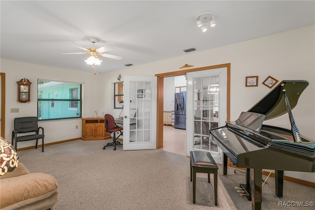 living area with visible vents, ceiling fan, french doors, and baseboards